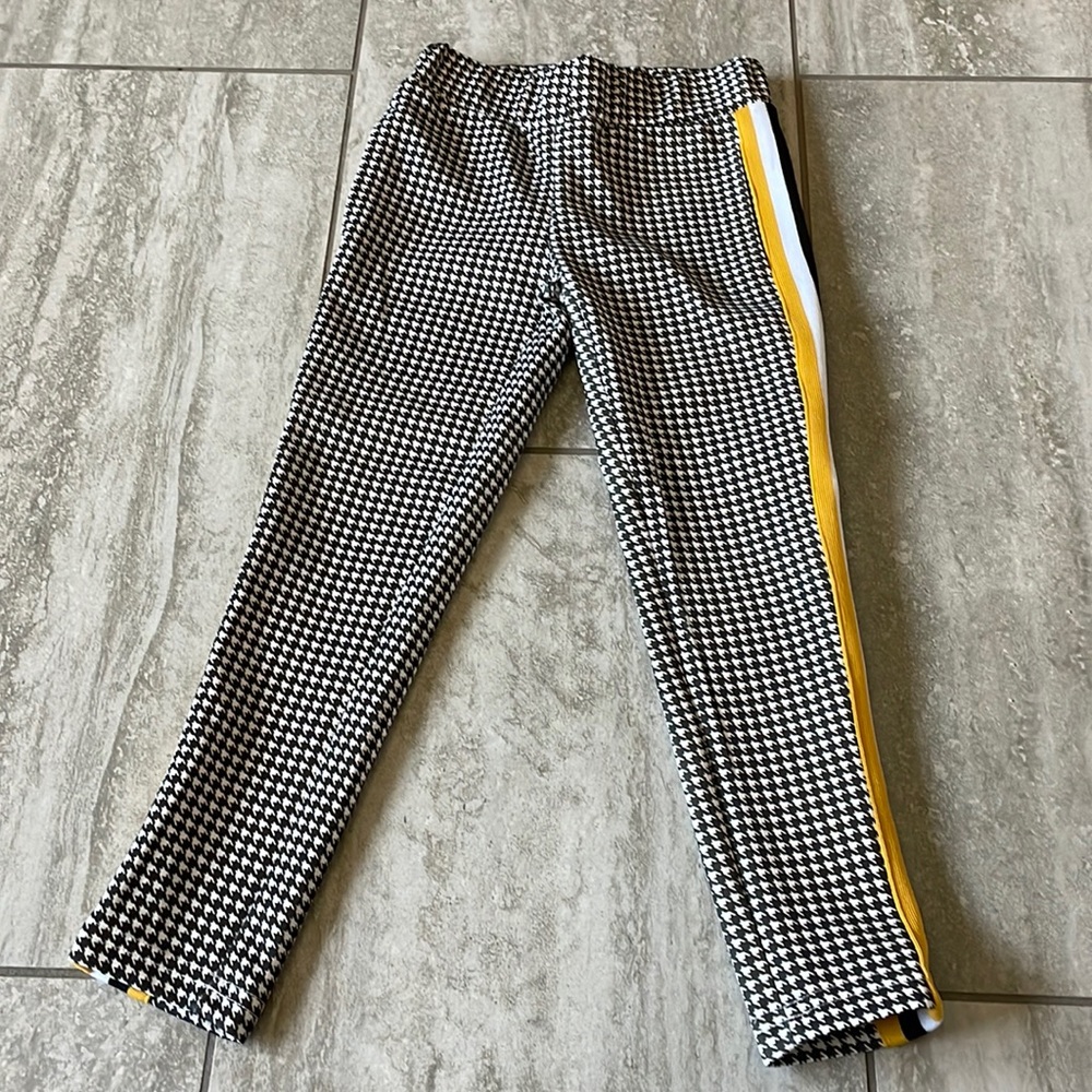 Ponytails black and white,(gold, black and white)strip on sides,long pants/girls